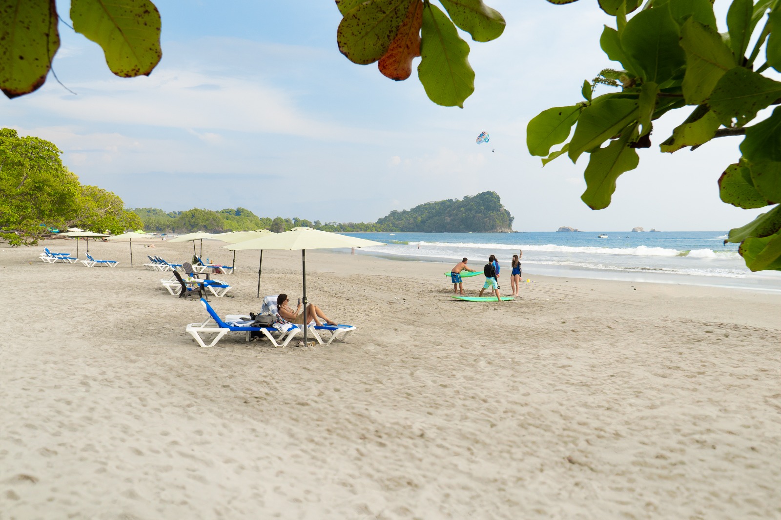 Dante's Watersports beach setup with loungers, umbrellas and boogie boards on Playa Espadilla
