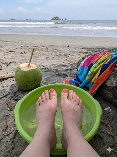 Relaxing beach foot bath with fresh coconut drink and colorful towel on Playa Espadilla
